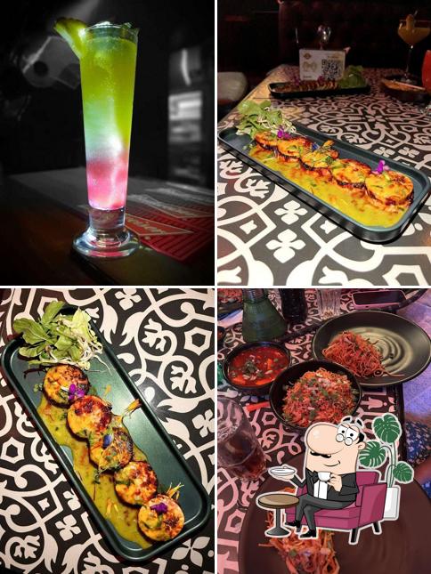 Take a seat at one of the tables at The Orange Mint Lounge - Thane