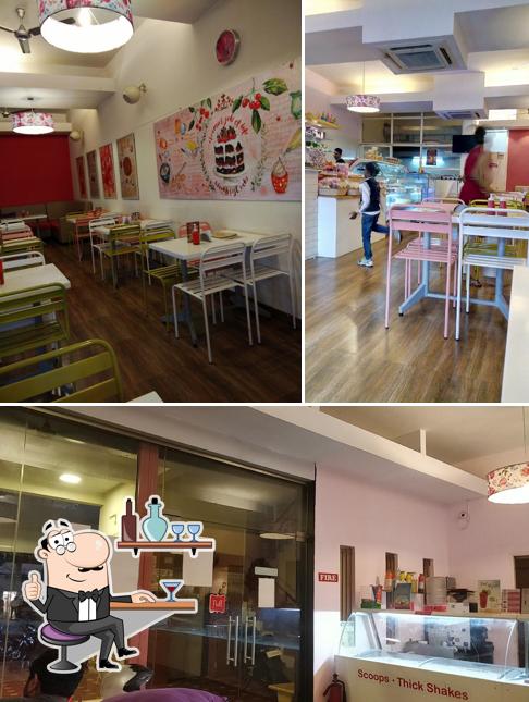 Take a seat at one of the tables at Puppy's Bakery - Exclusive Desserts Continental Cuisine Instagrammable Café in Madurai - Anna Nagar