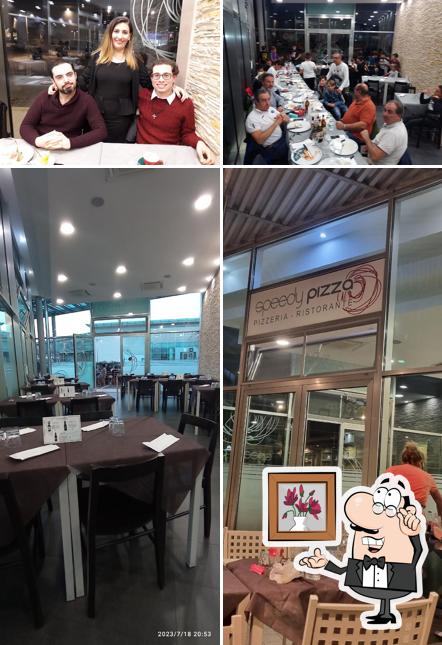 Siediti a un tavolo di Speedy Pizza