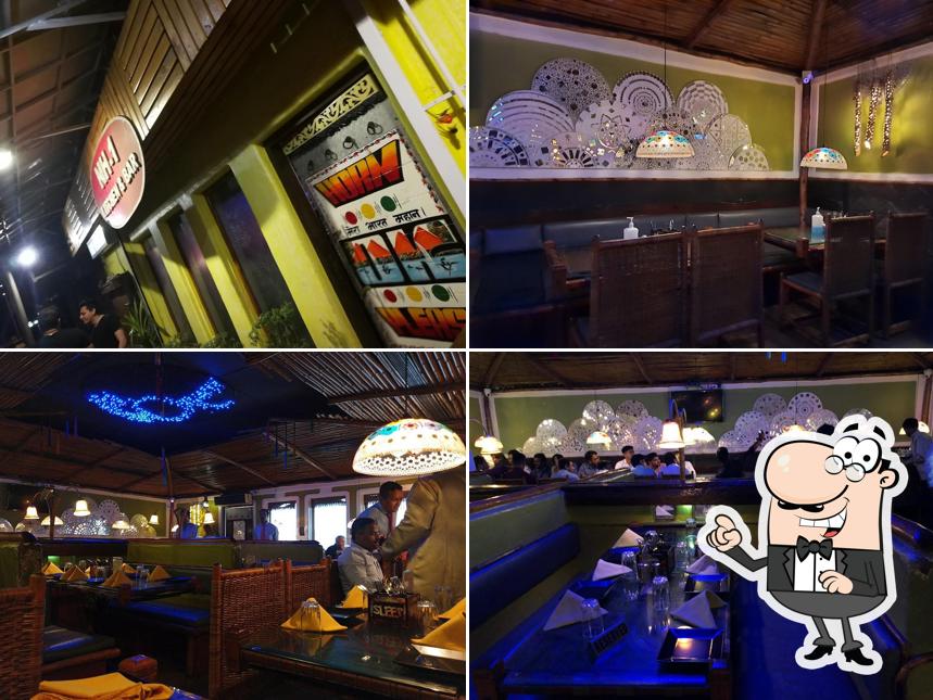 Take a seat at one of the tables at NH-1 Kitchen and Bar