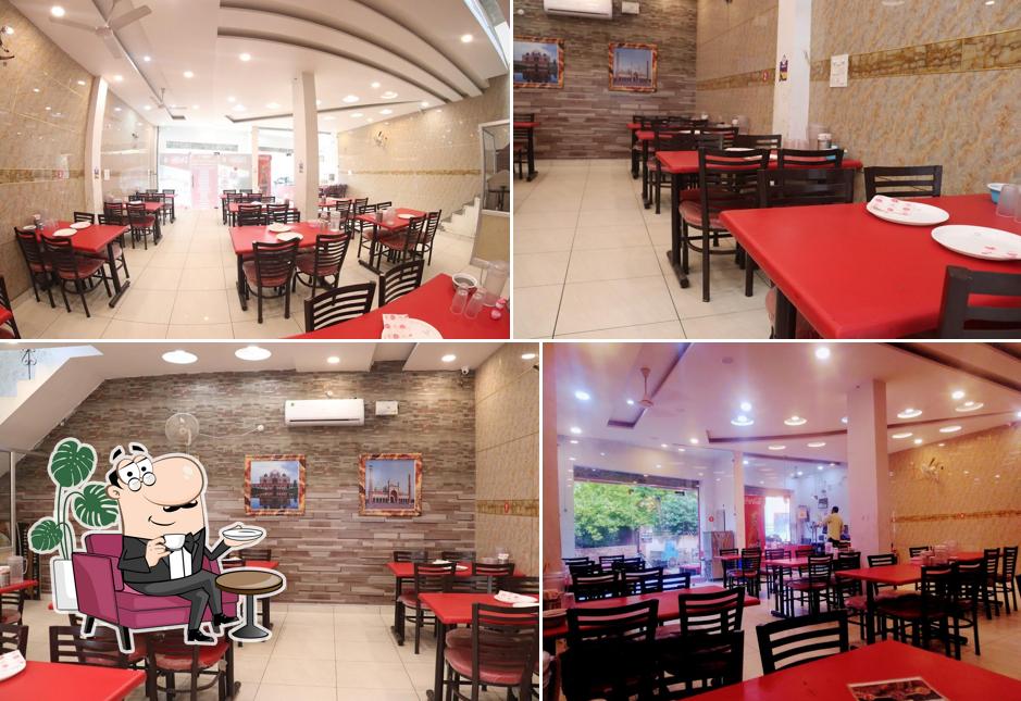 Take a seat at one of the tables at Delhi-6