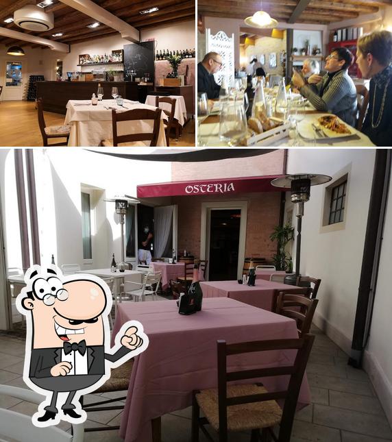 Siediti a un tavolo di Locanda Roma