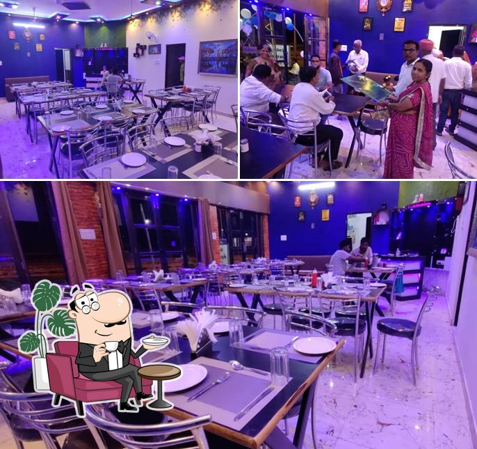 Take a seat at one of the tables at Shree Ratan (RJ RasRaj) AC garden restaurant sojat city