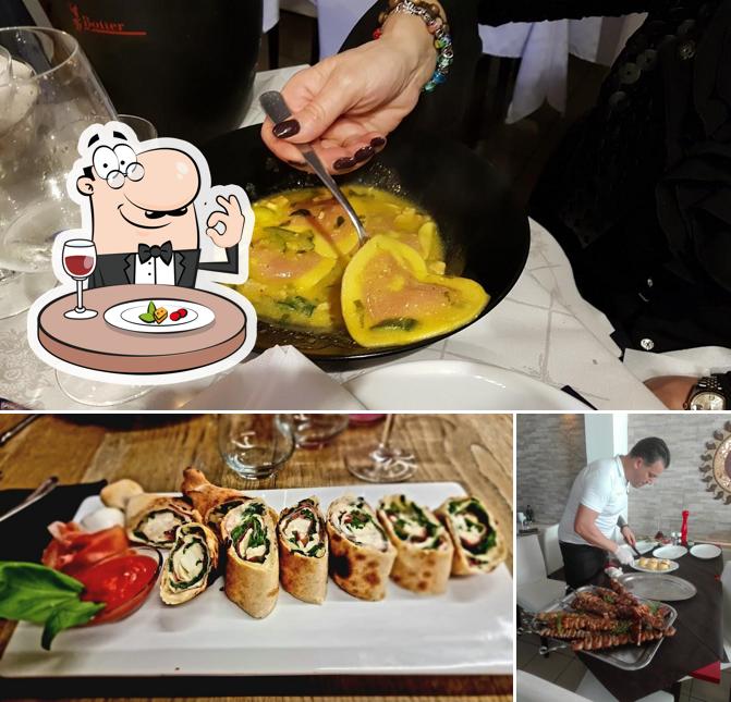 Ristorante Pizzeria Luna Nuova si caratterizza per la cibo e tavolo da pranzo