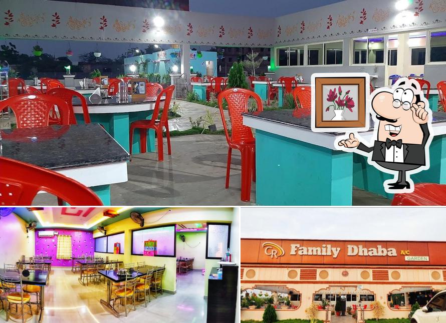 Take a seat at one of the tables at CR FAMILY DHABA A/C GARDEN