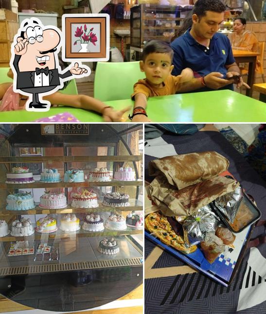 Take a seat at one of the tables at Darshan Sweets And Italian Bake Studio