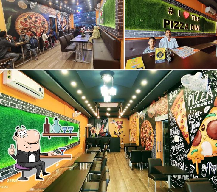 Take a seat at one of the tables at THE PIZZA DINE (BARABANKI)