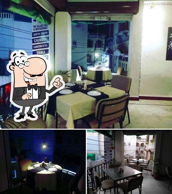 Take a seat at one of the tables at The Village Cafe & Restaurant