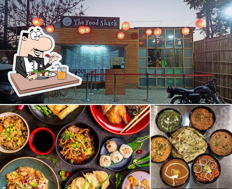 Check out the picture showing food and interior at The Food Shack