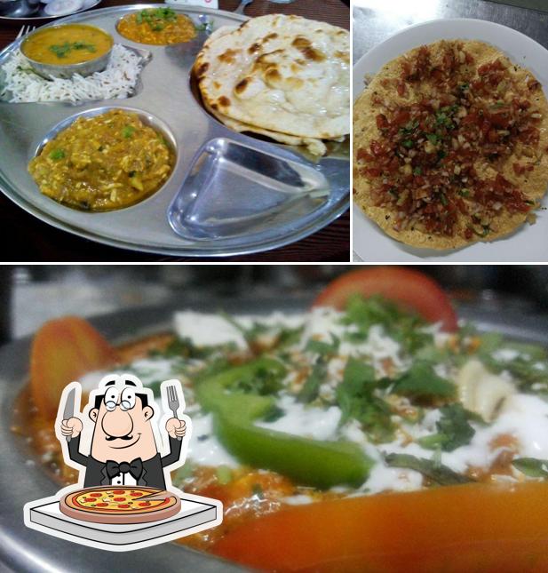 Get pizza at Ashirwad Restaurant