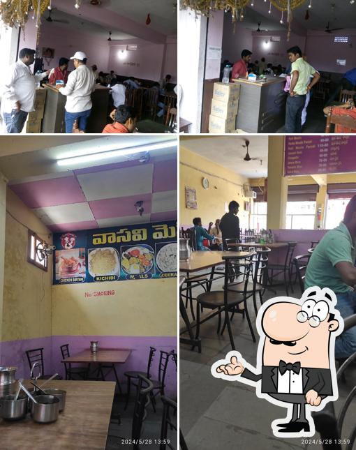 Take a seat at one of the tables at Vasavi Mess Restaurant (Veg & Nonveg)