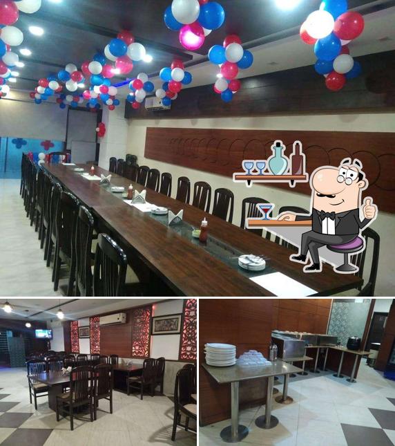 Take a seat at one of the tables at Royal Dawat Buffet Restaurant