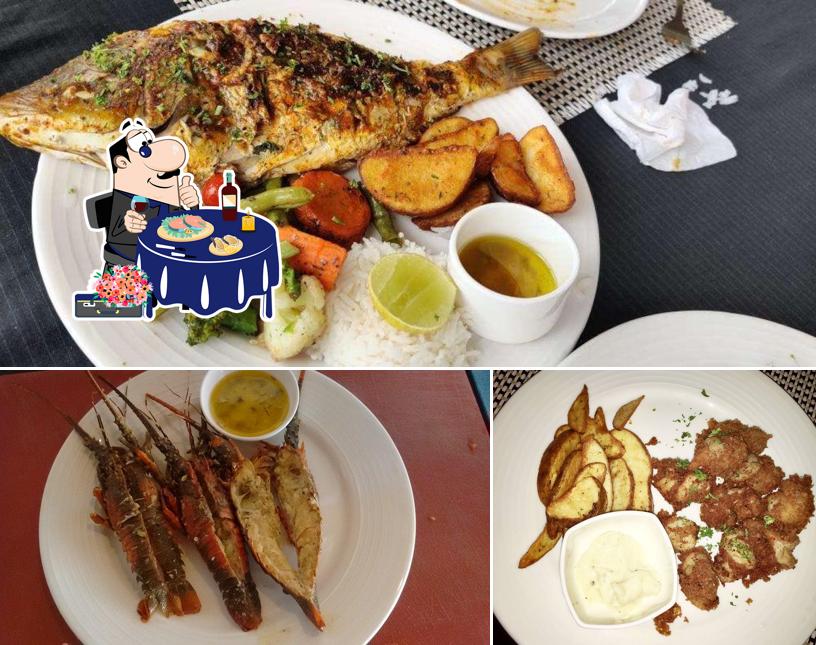 Try out seafood at Theevu Plage Beach Resort