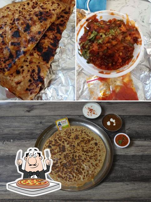 Try out pizza at Punjab De Parathe