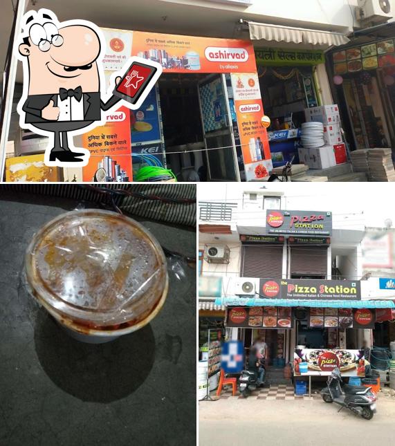 The image of exterior and beverage at The Pizza Station