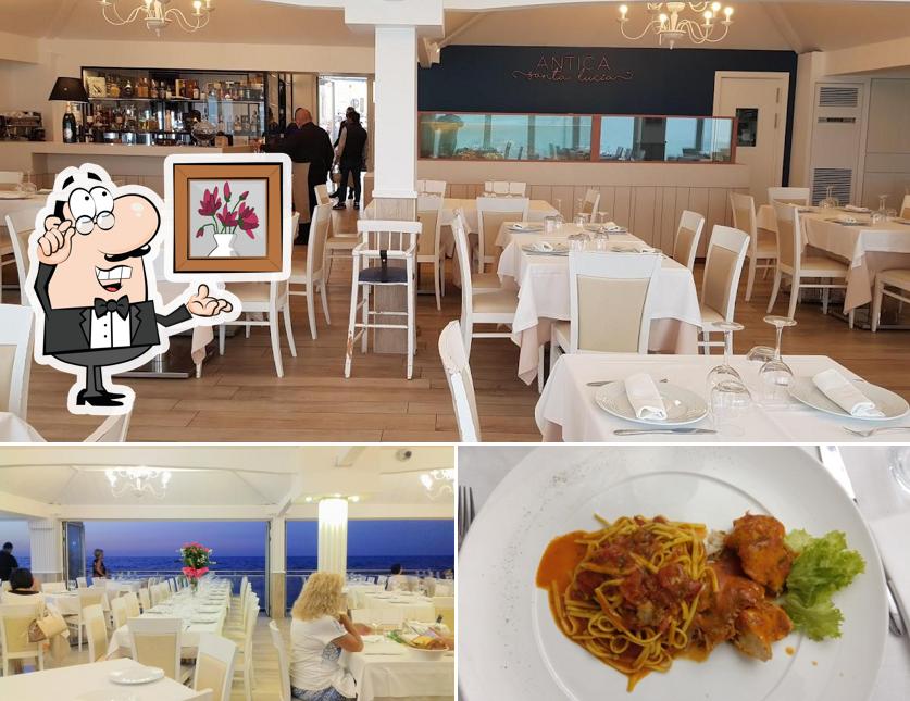 Questa è la foto che presenta la interni e cibo di Antica Santa Lucia