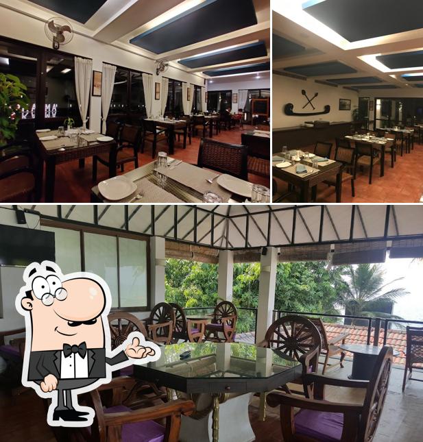 Take a seat at one of the tables at Karma Chakra - The Waterside Restaurant