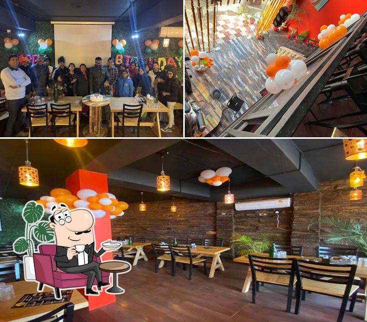 Take a seat at one of the tables at NH-30 cafe and restaurant