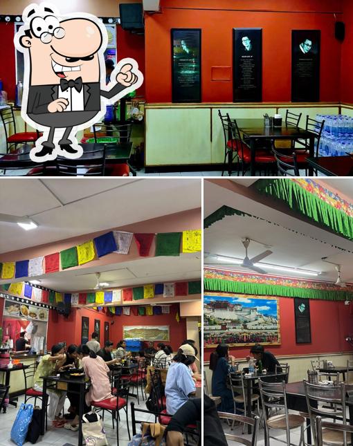 Take a seat at one of the tables at TASTE OF TIBET (BRIGADE ROAD)