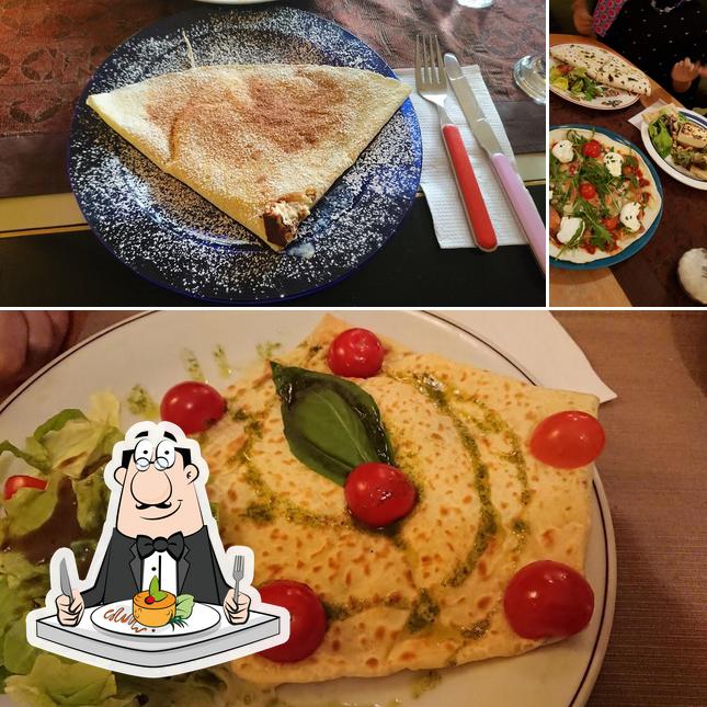 Questa è la foto che mostra la cibo e tavolo da pranzo di L'Annexe