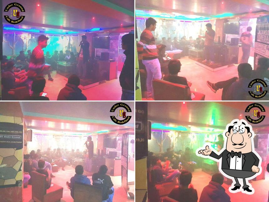 Take a seat at one of the tables at UG - Underground Cafe