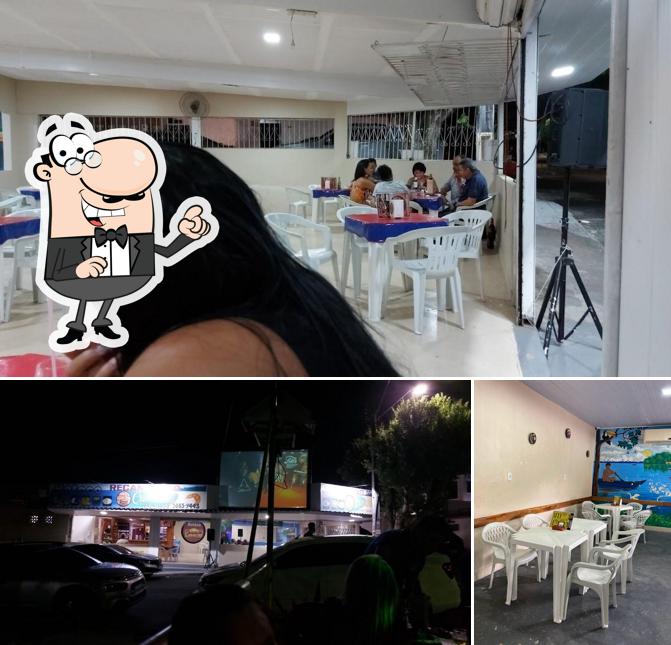A imagem do Recanto do Camarão’s interior e mesa de jantar
