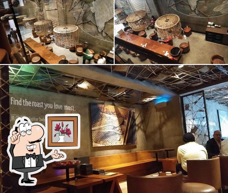 Take a seat at one of the tables at Starbucks coffee