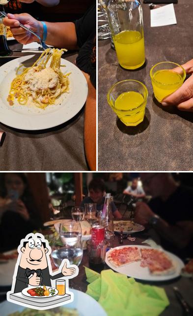 Rombo Pizzeria Ristorante si caratterizza per la cibo e tavolo da pranzo