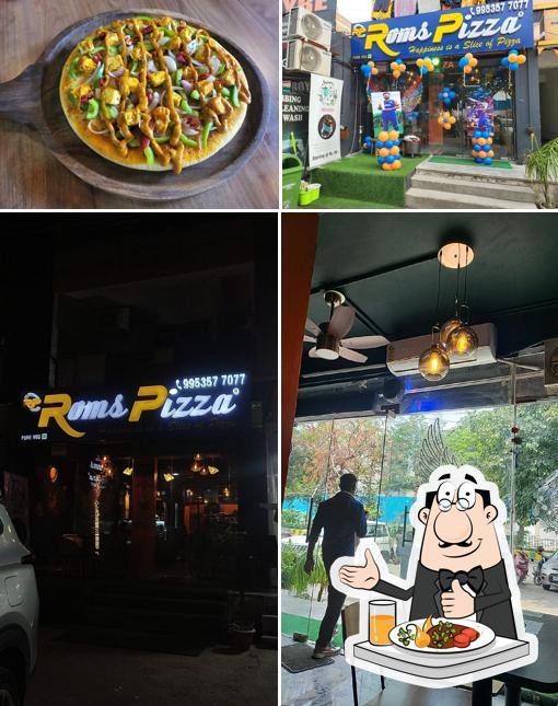 The image of food and exterior at Roms Pizza