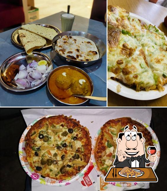 Get pizza at Chouhan Fast Food