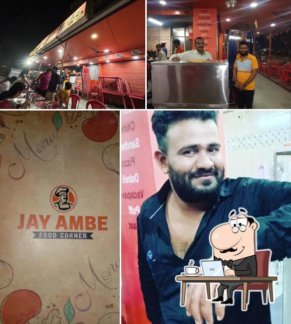 Take a seat at one of the tables at JAY AMBE FOOD CORNER