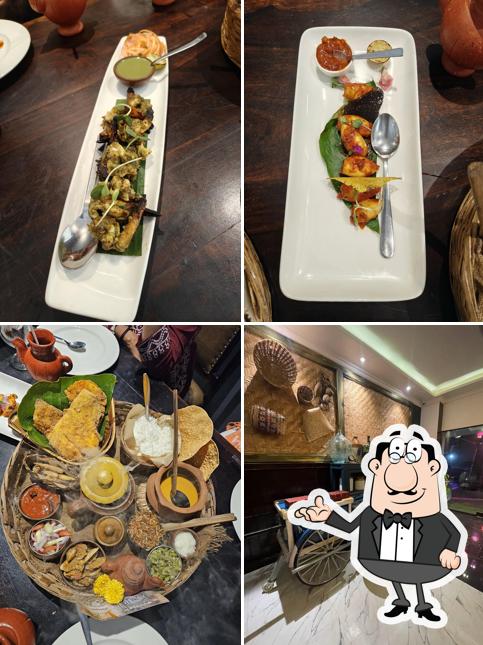Take a seat at one of the tables at Vintage Restaurant (Pernem)