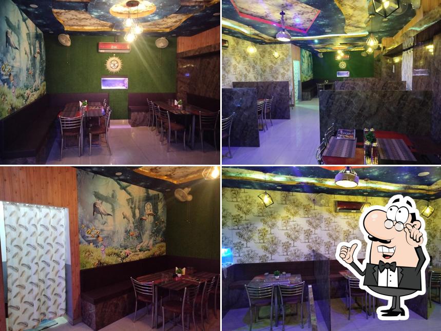 Take a seat at one of the tables at Hotel Village