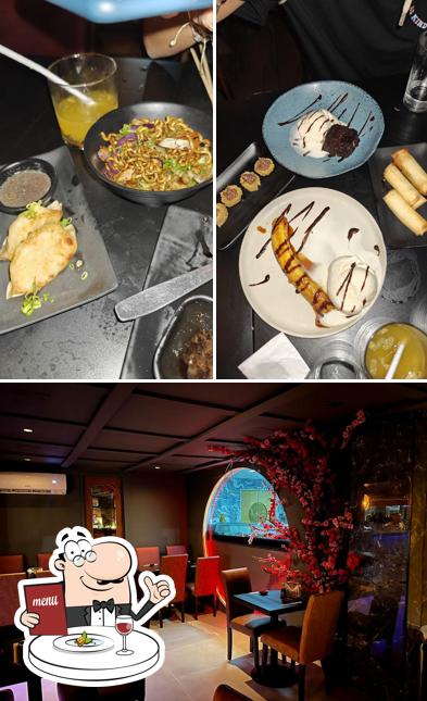 Entre diversos coisas, comida e interior podem ser encontrados no Bayam Sushi Bar