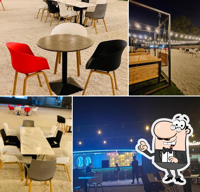 Take a seat at one of the tables at Cafe De Italiano