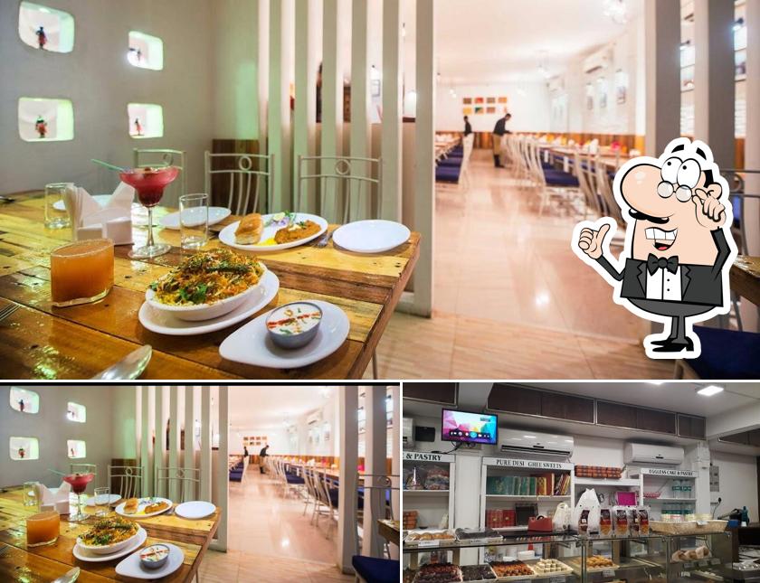 Take a seat at one of the tables at Icy Spicy - Pure Veg