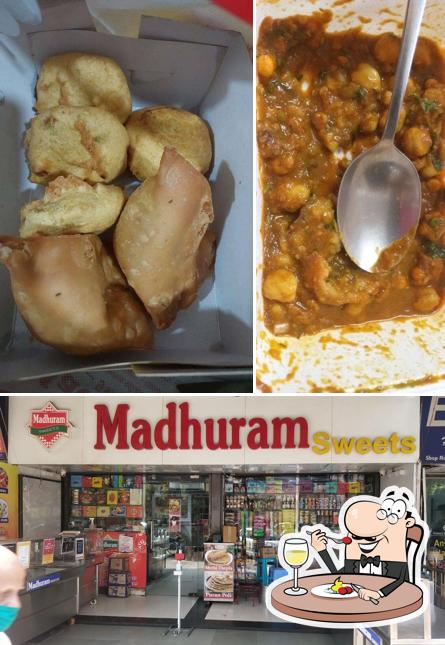 Take a look at the photo showing food and interior at Madhuram sweets