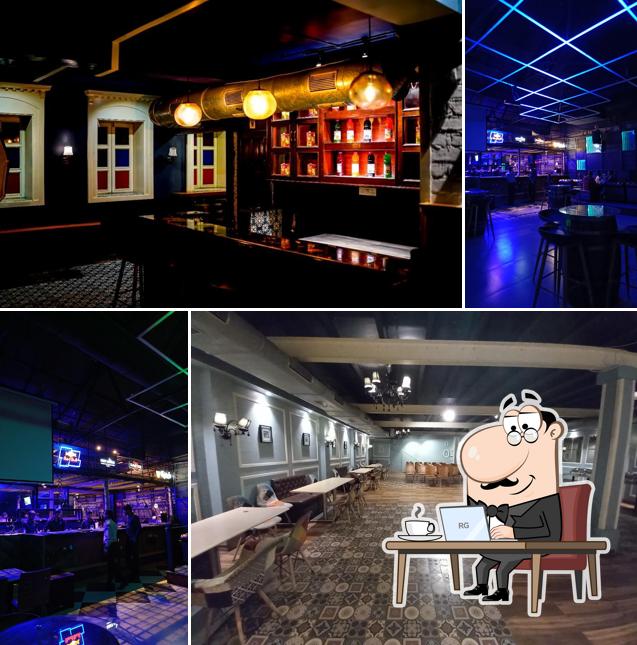 Take a seat at one of the tables at BPM Lounge Bar Booze Per Minute