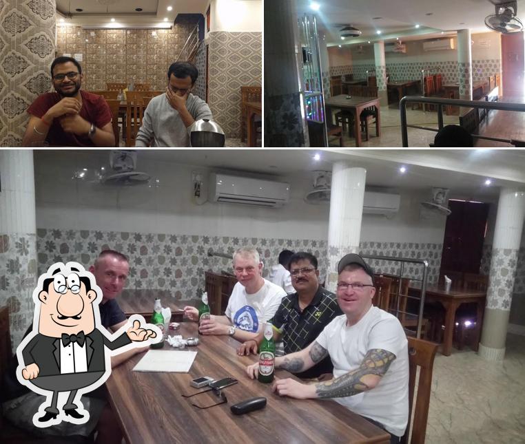 Take a seat at one of the tables at Relax Bar & Restaurant