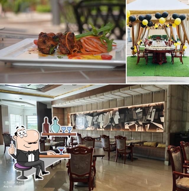 Take a seat at one of the tables at Raajsik - Indian Cuisine Restaurant