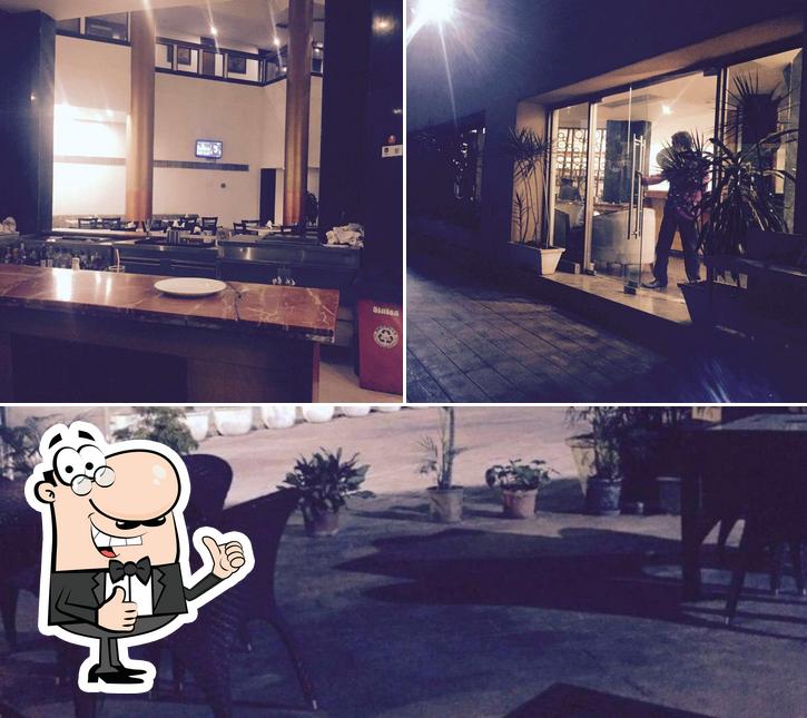 Look at this picture of Poolside Restaurant & Bar