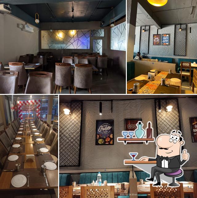 Take a seat at one of the tables at Sitara Family Restaurant