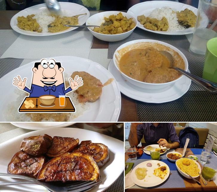 Check out the picture displaying food and dining table at Bijoli Grill