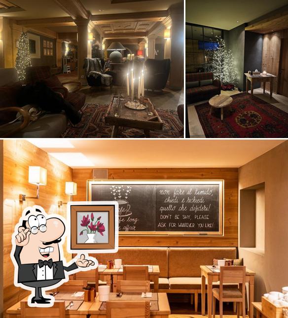 Siediti a un tavolo di Hotel La Genzianella