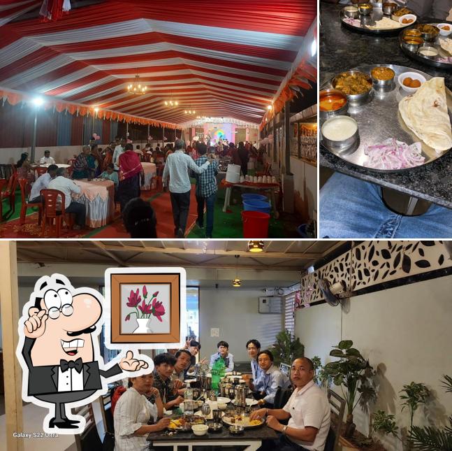 Among various things one can find interior and dining table at Hotel Red Chilly, Karad