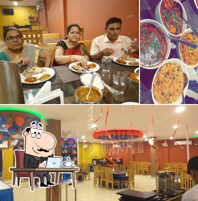 Take a seat at one of the tables at Trisha Food & Cafe and Banquet