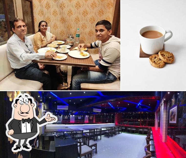 Take a look at the image depicting interior and beverage at Aao Kabhi Haveli Pe Restaurant