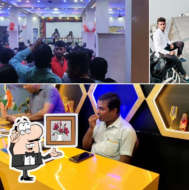 Take a seat at one of the tables at Hotel Parth