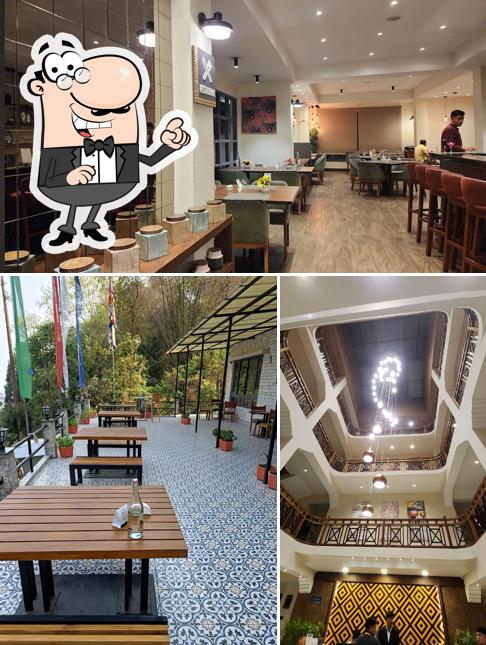 Take a seat at one of the tables at Grains Pure Veg by Udaan Olive, Pelling