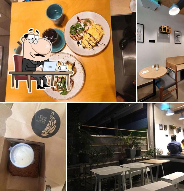 Take a seat at one of the tables at Blue Tokai Coffee Roasters Oshiwara